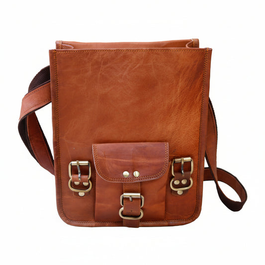Brown leather bag with gold buckles on a white background