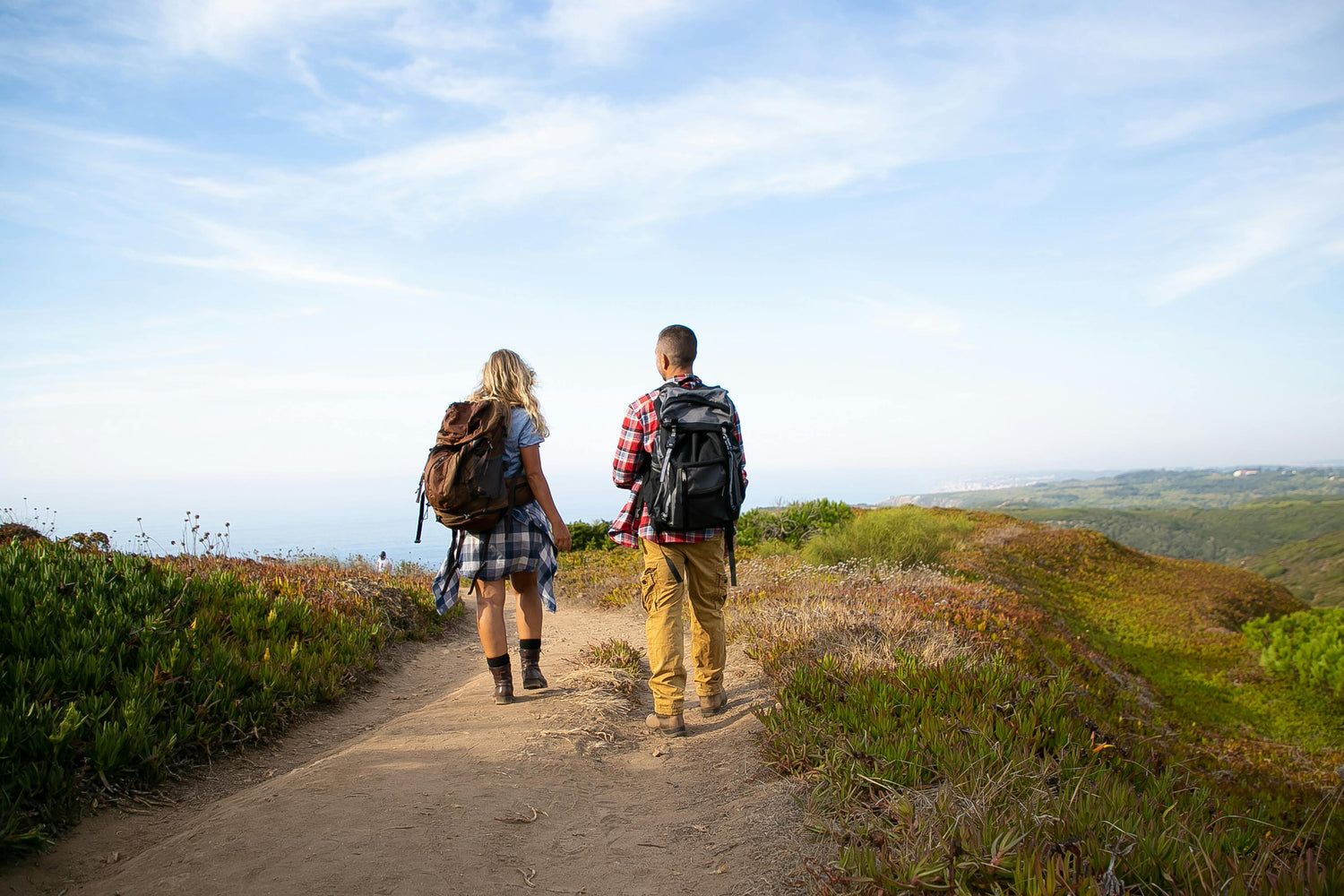 Two person have backpacks on hiking