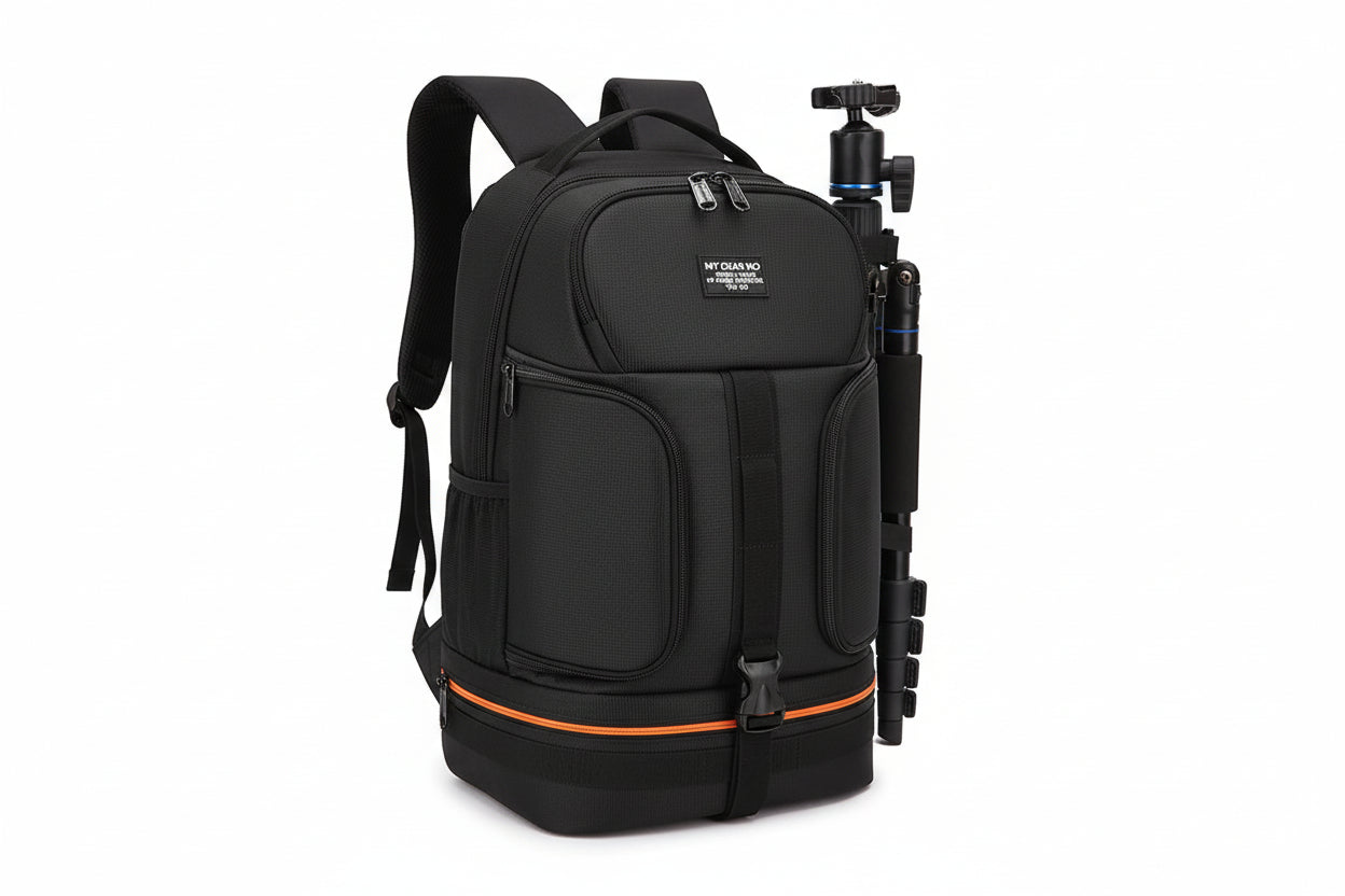 Black backpack with camera equipment on a white background