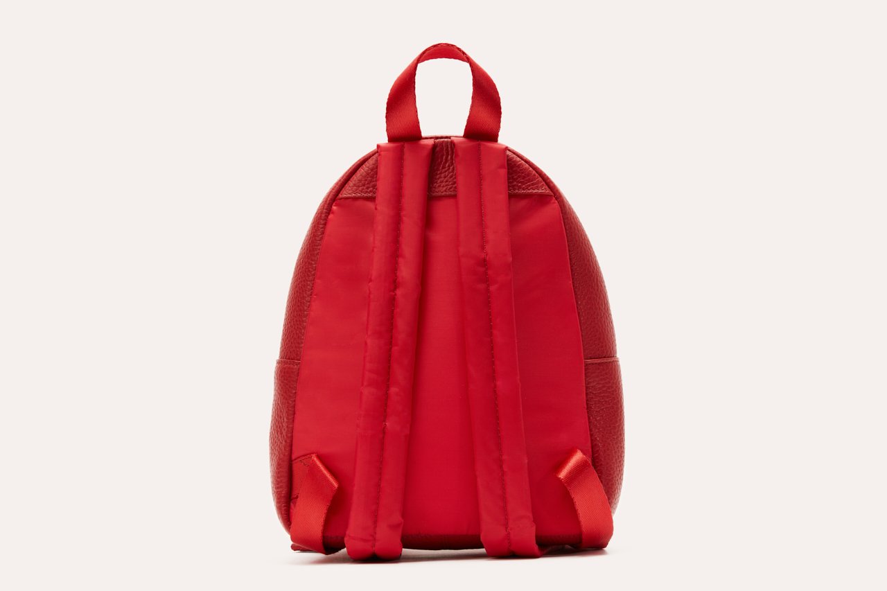 Red backpack on a white background