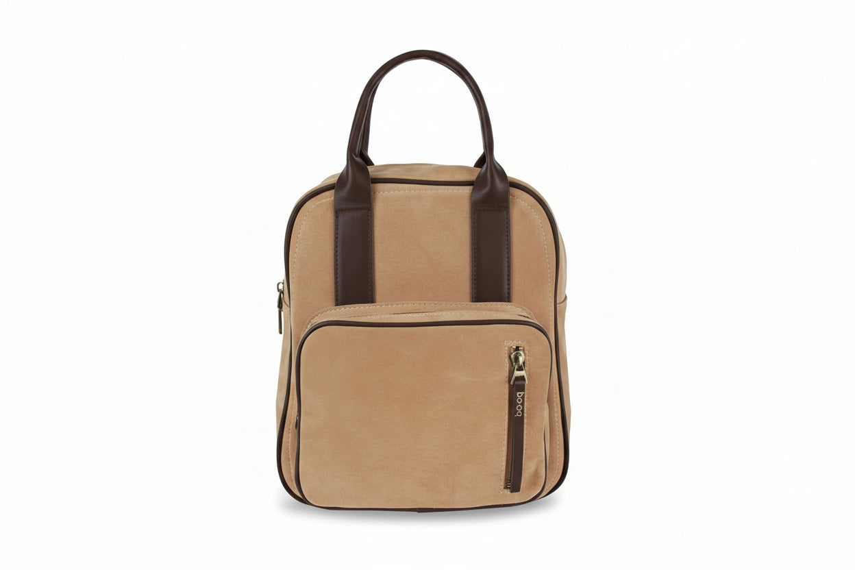 Beige backpack with brown straps on a white background
