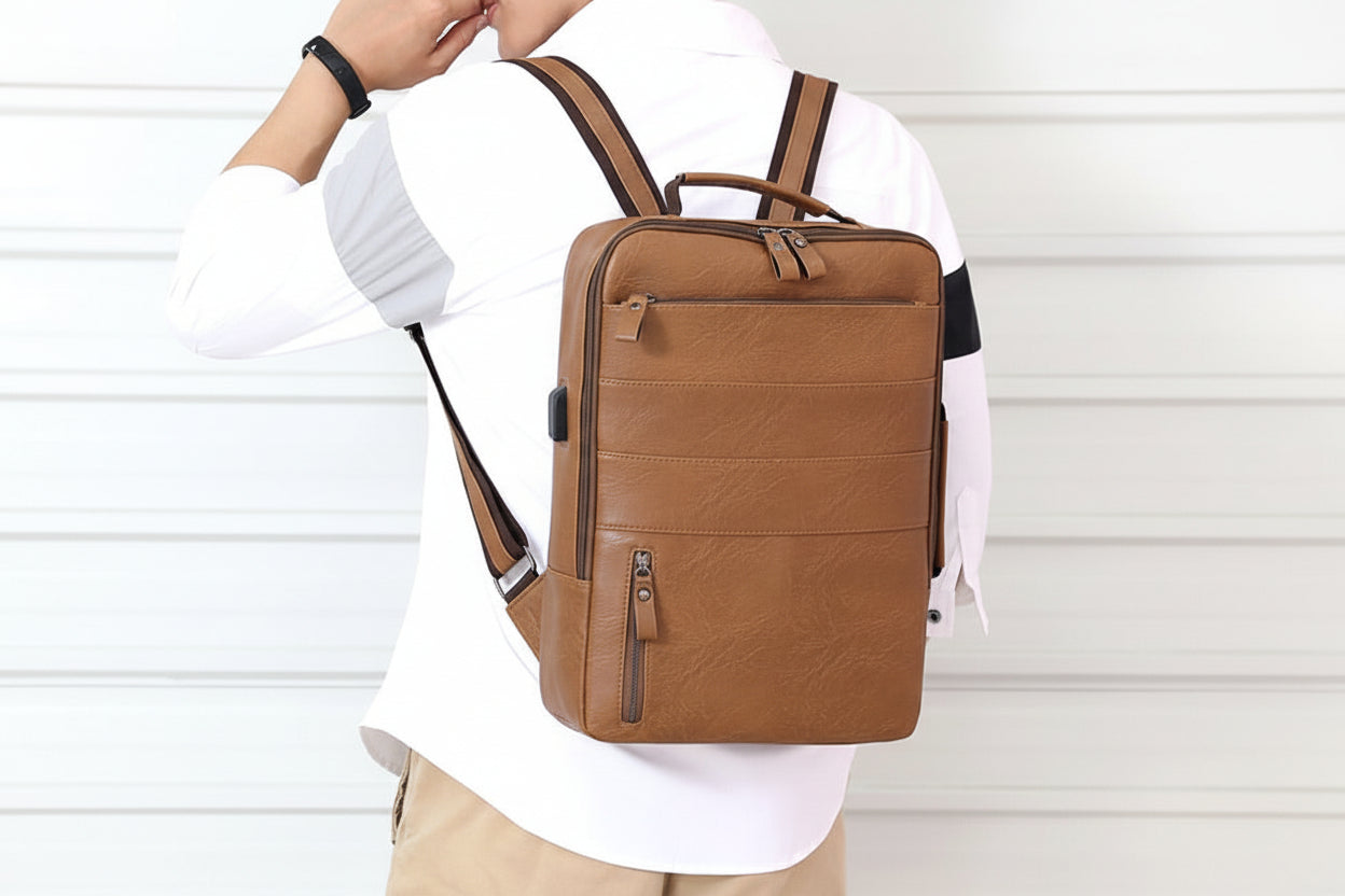 Person wearing a brown backpack against a white background
