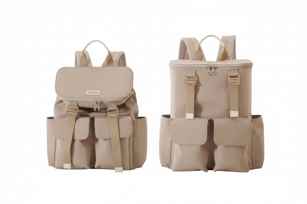 Two beige backpacks with multiple pockets on a white background