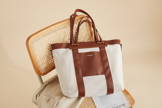 Brown and beige tote bag on a chair with a neutral background