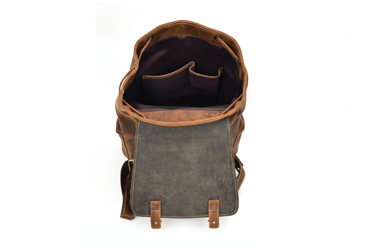 Backpack with brown leather accents on a white background