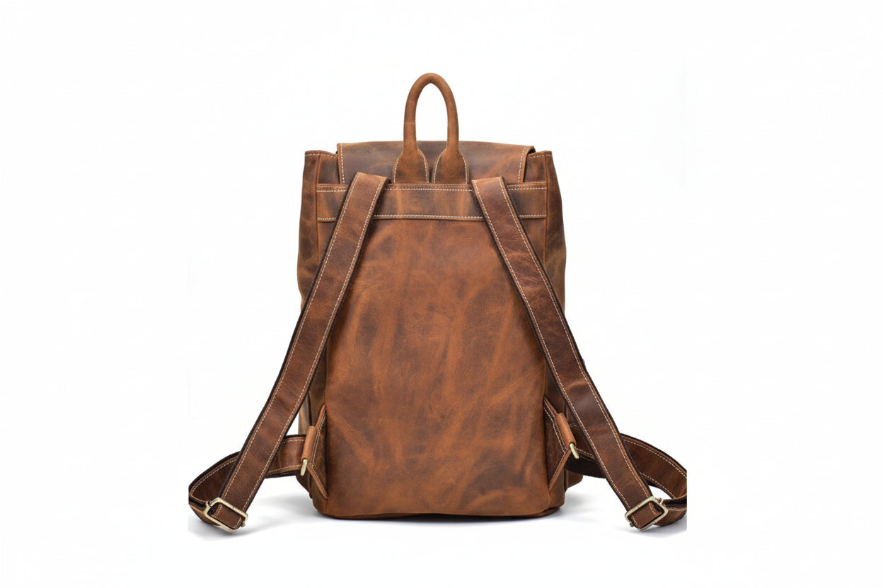 Brown leather backpack on a white background
